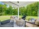 Relaxing covered patio with wooded views and seating at 8611 Frank Grier Rd # 1, Charlotte, NC 28215
