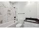 Stylish bathroom features a marble tiled shower-tub combination and modern vanity at 5225 Glenwalk Dr # 0061, Charlotte, NC 28269