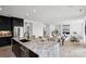 Open-concept kitchen with stainless steel appliances, center island, and easy access to the living area at 5225 Glenwalk Dr # 0061, Charlotte, NC 28269