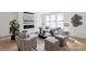 Cozy living room featuring a fireplace, neutral furniture, and large windows offering ample natural light at 5225 Glenwalk Dr # 0061, Charlotte, NC 28269