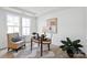 Home office featuring natural light, a cozy chair, modern art, and stylish decor at 5225 Glenwalk Dr # 0061, Charlotte, NC 28269