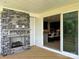 Outdoor patio features a stone fireplace with an interior view of the kitchen at 5225 Glenwalk Dr # 0061, Charlotte, NC 28269