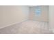 Bedroom with grey carpet and window with blinds at 1608 Cannonball Ln, Bessemer City, NC 28016