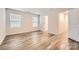 Well-lit bedroom features wood-look floors and ample natural light at 1608 Cannonball Ln, Bessemer City, NC 28016