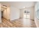 Spacious Gathering room with wood-look floors and sliding glass doors leading to the backyard at 1608 Cannonball Ln, Bessemer City, NC 28016