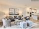 Open living room featuring a neutral color palette, plush seating, and a stylish coffee table at 4062 Skyboat Cir, Fort Mill, SC 29715