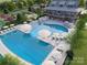 Community pool with expansive deck and lounge chairs at 4062 Skyboat Cir, Fort Mill, SC 29715
