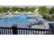 Relaxing pool area with lounge chairs and umbrellas at 4062 Skyboat Cir, Fort Mill, SC 29715