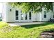 Home's backyard with patio and grassy area at 147 Fesperman Cir, Troutman, NC 28166