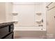 Bathroom with tub, shower, and granite vanity at 147 Fesperman Cir, Troutman, NC 28166