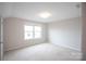 Bright bedroom with neutral walls and carpet at 147 Fesperman Cir, Troutman, NC 28166
