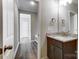 Modern bathroom with granite countertops and updated fixtures at 822 N Rocky River Rd, Monroe, NC 28110