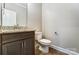 Small bathroom with granite vanity and single sink at 822 N Rocky River Rd, Monroe, NC 28110