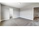 Bedroom with carpet flooring, and doors to closet and bathroom at 822 N Rocky River Rd, Monroe, NC 28110