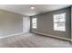 Spacious bedroom with neutral walls and new carpeting at 822 N Rocky River Rd, Monroe, NC 28110