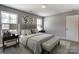 Spacious bedroom with carpeted floor and natural light at 822 N Rocky River Rd, Monroe, NC 28110