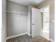 Walk-in closet with wire shelving and door to bathroom at 822 N Rocky River Rd, Monroe, NC 28110
