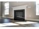 Modern fireplace with white mantel and black insert at 822 N Rocky River Rd, Monroe, NC 28110