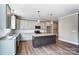 Open concept kitchen with granite countertops and island at 822 N Rocky River Rd, Monroe, NC 28110