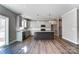 Open kitchen with island, granite countertops, and stainless steel appliances at 822 N Rocky River Rd, Monroe, NC 28110