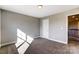 Bright bedroom with window and neutral decor at 824 N Rocky River Rd, Monroe, NC 28110