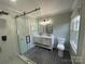 Modern bathroom featuring a walk-in shower and double vanity at 647 Reeves Ct, Charlotte, NC 28208