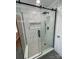 Modern bathroom with a frameless glass shower and marble tile at 647 Reeves Ct, Charlotte, NC 28208