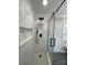 Modern bathroom with a frameless glass shower and marble tile at 647 Reeves Ct, Charlotte, NC 28208