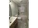 Renovated bathroom with a bathtub, new fixtures, and modern tile at 647 Reeves Ct, Charlotte, NC 28208