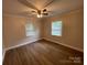 Well-lit bedroom with neutral walls and wood-look flooring at 647 Reeves Ct, Charlotte, NC 28208