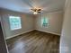 Spacious bedroom with neutral walls and wood-look flooring at 647 Reeves Ct, Charlotte, NC 28208