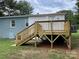 Newly built wooden deck with stairs, leading from the house to the backyard at 647 Reeves Ct, Charlotte, NC 28208