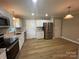 Updated kitchen with stainless steel appliances and granite countertops at 647 Reeves Ct, Charlotte, NC 28208
