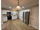 Bright kitchen with stainless steel appliances and granite countertops at 647 Reeves Ct, Charlotte, NC 28208
