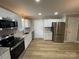 Renovated kitchen, featuring stainless steel appliances at 647 Reeves Ct, Charlotte, NC 28208