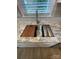 Modern kitchen sink with a built-in cutting board and drainer at 647 Reeves Ct, Charlotte, NC 28208