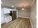 Bright kitchen with white cabinets, stainless steel appliances, and granite countertops at 647 Reeves Ct, Charlotte, NC 28208