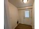 Laundry room with new flooring and access to the outside at 647 Reeves Ct, Charlotte, NC 28208