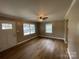 Spacious living area with hardwood floors, lots of natural light, and ceiling fan at 647 Reeves Ct, Charlotte, NC 28208
