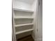 White spacious pantry with four shelves for extra storage at 647 Reeves Ct, Charlotte, NC 28208