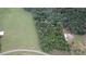 Aerial view showing house, large grassy area, and wooded acreage at 1025 Patterson Farm Rd, Mooresville, NC 28115