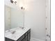 Double vanity bathroom with a large mirror and dark cabinets at 1025 Patterson Farm Rd, Mooresville, NC 28115