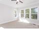 Spacious bedroom with large windows and carpeted floors at 1025 Patterson Farm Rd, Mooresville, NC 28115
