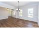 Spacious dining room with hardwood floors and access to the kitchen at 1025 Patterson Farm Rd, Mooresville, NC 28115