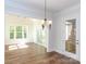 Bright dining room with hardwood floors and view to sunroom at 1025 Patterson Farm Rd, Mooresville, NC 28115