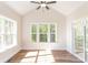Sunroom features hardwood floors, windows, and access to deck at 1025 Patterson Farm Rd, Mooresville, NC 28115