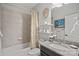 Simple bathroom with a tub shower combination and floating shelves at 16015 Vale Ridge Dr # 133, Charlotte, NC 28278