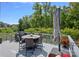 Spacious deck with dining area and umbrella, perfect for outdoor entertaining at 16015 Vale Ridge Dr # 133, Charlotte, NC 28278