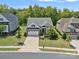 Two-story home with two car garage and manicured landscaping at 16015 Vale Ridge Dr # 133, Charlotte, NC 28278