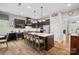 Modern kitchen with large island, stainless steel appliances, and wine cooler at 16015 Vale Ridge Dr # 133, Charlotte, NC 28278